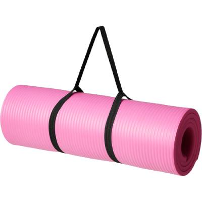amazon basics extra thick yoga mat in pink with carrying strap.